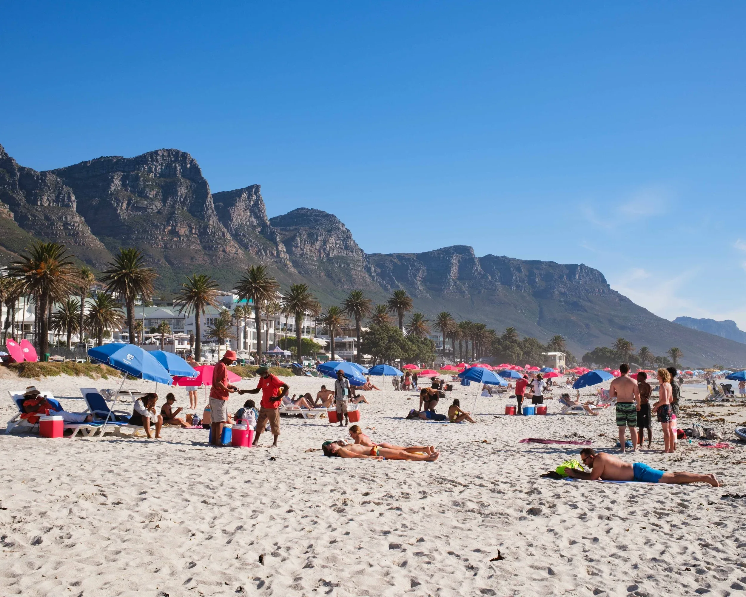 Camps Bay beach with the Twelve Apostles rising behind it