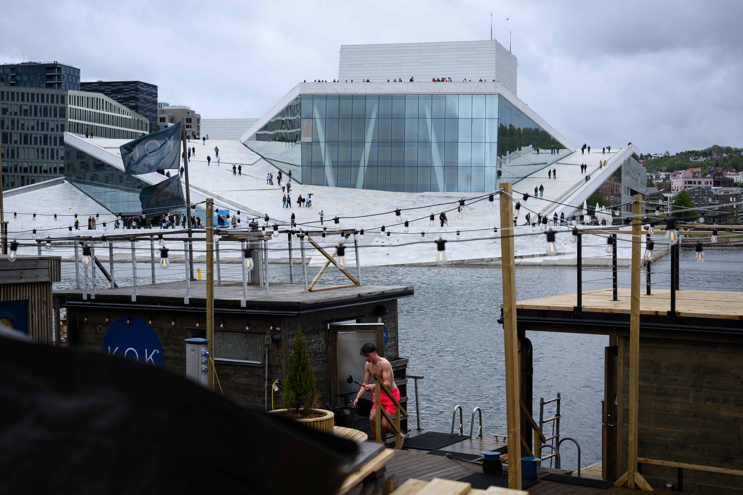 The KOK floating sauna at Langkaia, with the Opera House roof across the water